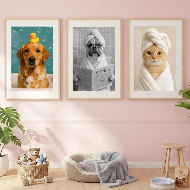 May include: Three framed wall art prints featuring animals in bathroom settings. The left print shows a golden retriever with bubbles and a yellow rubber duck. The center black and white print shows a bulldog reading a newspaper. The right print shows a cat in a white towel.