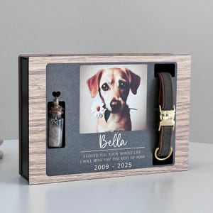 May include: A wooden box with a photo of a dog, a small glass vial, and a brown leather dog collar. The photo is of a brown and white dog with a daisy in its mouth. The text on the box reads "Bella I LOVED YOU YOUR WHOLE LIFE. I WILL MISS YOU THE REST OF MINE 2009 - 2025".