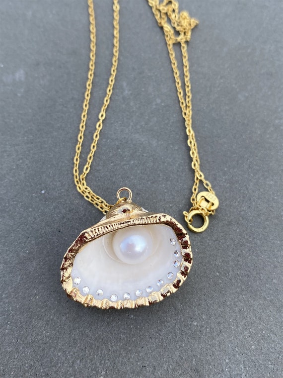 Clam and pearl necklace deals