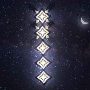 May include: A row of six gold star-shaped lights against a dark blue background with white stars. The lights are arranged vertically in a line.