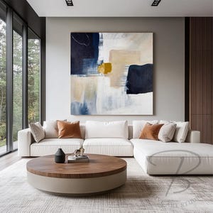 a living room with a large painting on the wall