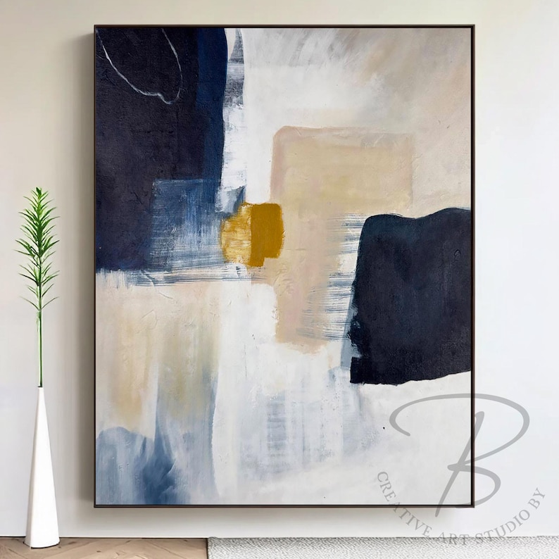 a painting hanging on a wall next to a vase