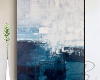 May include: Abstract painting with blue and white brushstrokes. The painting has a textured look and is framed in a black frame.