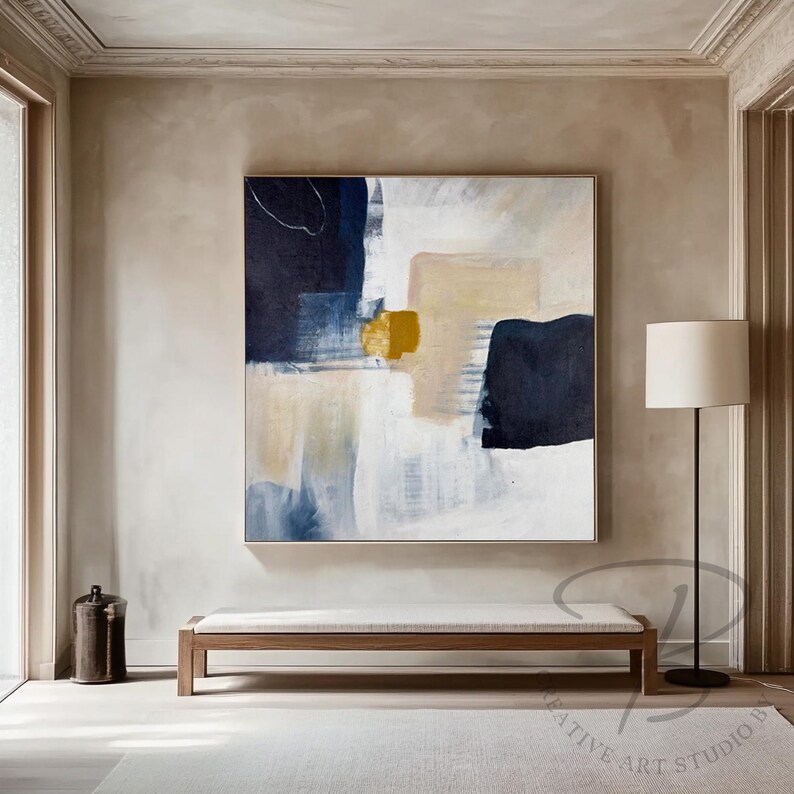 a painting hanging on a wall in a living room