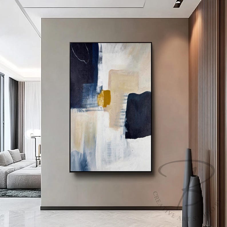 a painting hanging on a wall in a living room