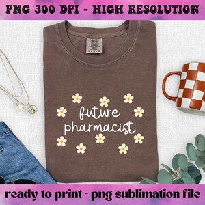 May include: A brown t-shirt with the text "future pharmacist" in white script surrounded by small yellow daisy flowers. The shirt is ready to print.