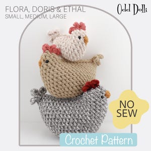 May include: Three crocheted chicken toys stacked on top of each other. The top chicken is off-white, the middle is tan, and the bottom is gray. The chickens have red combs and orange beaks. The image includes the text "FLORA, DORIS & ETHAL" and "Crochet Pattern."
