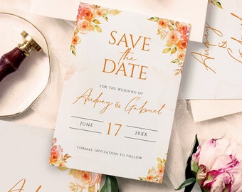 May include: Save the date card with floral design. The card is white with orange and pink flowers and green leaves. The text reads "Save the Date" with the names "Audrey & Gabriel" and the date "June 17, 20XX".