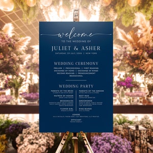 May include: A navy blue wedding welcome sign with white text. The sign lists the names of the couple, Juliet & Asher, the date of the wedding, and the wedding party.