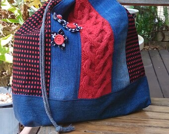 red/black knit panel drawstring bag