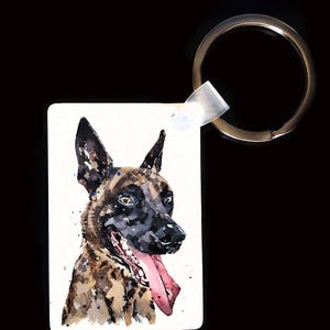 May include: A rectangular keychain featuring a watercolor painting of a dog's head. The dog has brown and black fur, a black nose, and a pink tongue. The keychain has a silver metal ring attached to a clear plastic tab.
