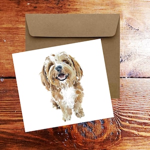 May include: A watercolor illustration of a brown and white dog with a happy expression. The dog is looking directly at the viewer.