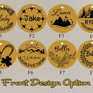 May include: A collection of eight gold-colored pet tags with black engraved designs. Each tag features a name, along with decorative elements such as hearts, mountains, floral patterns, and contact information. The text "Front Design Option" is at the bottom.