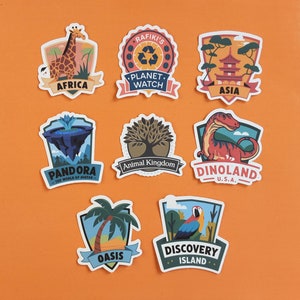 May include: Nine colourful stickers with different designs and text. The stickers feature images of a giraffe, a tree, a dinosaur, a pagoda, a palm tree, a parrot, and a floating island. The text on the stickers includes "Africa", "Planet Watch", "Asia", "Pandora", "Animal Kingdom", "Dinoland", "Oasis", and "Discovery Island".