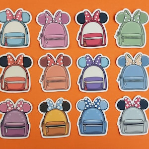 May include: Twelve colourful cartoon backpacks with Minnie Mouse ears and bows. Each backpack has a different colour and design, including red, blue, green, purple, orange, yellow, and pink.