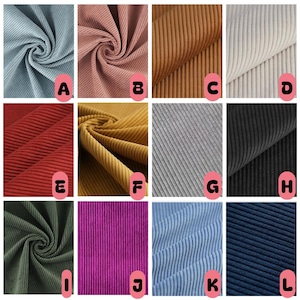 May include: A grid of twelve swatches of corduroy fabric in various colors, labeled A through L. The colors include light blue, dusty pink, tan, cream, red, mustard yellow, gray, black, olive green, magenta, sky blue, and navy blue.