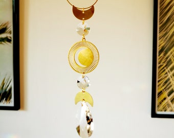 The Suncatcher small Moon - modern sun catcher with moon and rainbow crystals for hanging in the window with a rainbow effect in gold