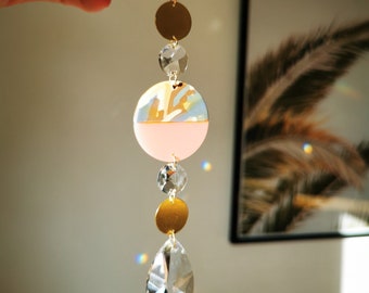 The Suncatcher small - circle beige pink modern suncatcher with rainbow crystals for hanging for the window with a rainbow effect