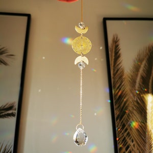 The Suncatcher Mini Moonlight - Small sun catcher with moon, moon phase and rainbow crystal for hanging in the window with a rainbow effect