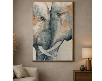 May include: Watercolor painting of two elephants facing each other, their trunks intertwined. The artwork features shades of blue, gray, and brown, with visible brushstrokes. The painting is framed in a light brown wooden frame, suitable for home decor.