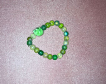 Green bracelet with skull bead