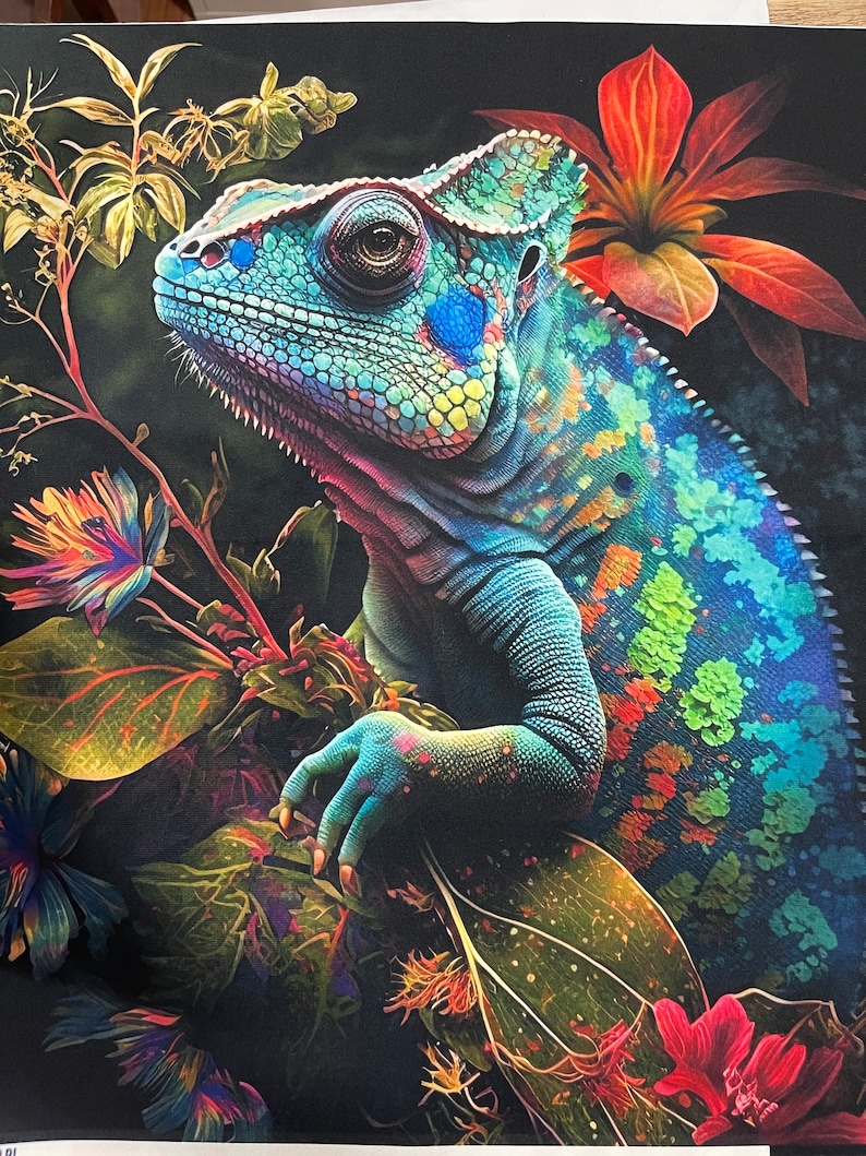 May include: A vibrant blue chameleon with green, orange, and red spots is perched on a branch of lush green leaves and flowers. The chameleon's eye is focused on something off-camera.