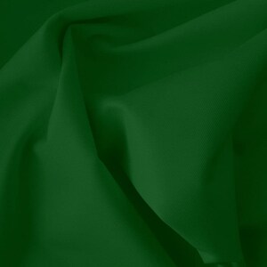 Peut inclure: Un gros plan sur un tissu vert foncé avec des plis et des rides doux.