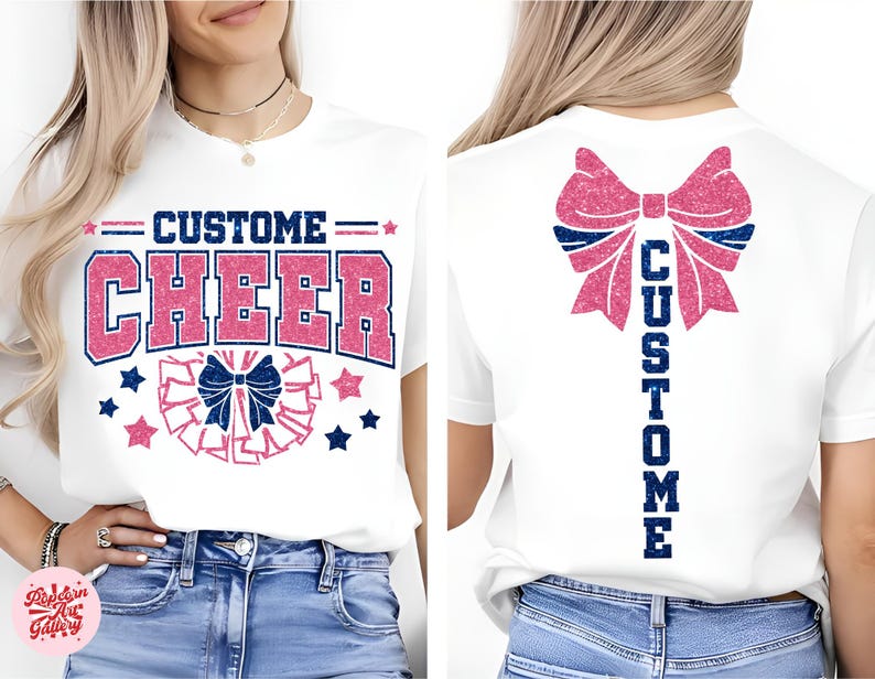 May include: White t-shirt with "CUSTOM CHEER" in pink and blue glitter text. The front design includes a cheer bow and stars. The back of the shirt features a large pink bow and the word "CUSTOM" in blue glitter.