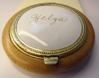 Vintage powder makeup compact with the name Helga on top