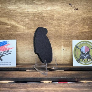 May include: A black patch with a skull and crossbones design. The skull is wearing a red, white, and blue bandana. The text "212th Fox Trot Tactical" is above the skull and the text "Coins & Patches" is below the skull.