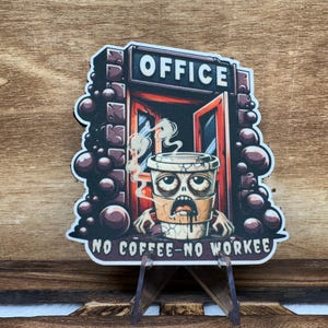 May include: A cartoon coffee cup with a zombie face and the text "NO COFFEE-NO WORKEE" is standing in front of a red door with the word "OFFICE" above it. The background is a dark brown with brown circles.