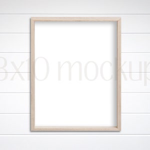 8x10 Minimalist White Wall Art Mockup with Wooden Frame for Creative Designs