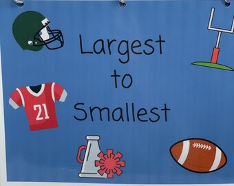 May include: A blue card with the words "Largest to Smallest" printed on it. There are five images on the card: a football helmet, a football jersey, a football, a megaphone, and a goal post.