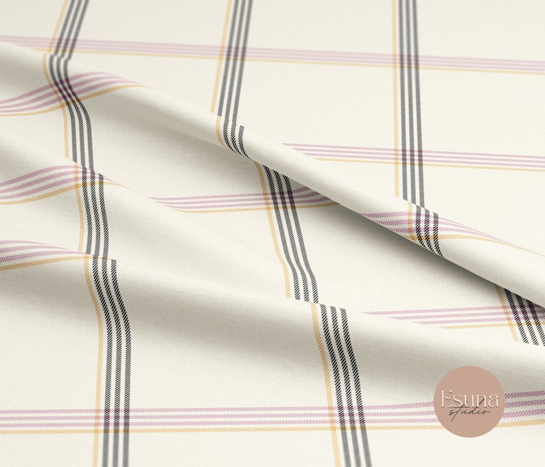 May include: White fabric with a plaid pattern in black, pink, and yellow stripes. The fabric is folded and draped.