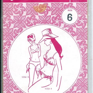 May include: A sewing pattern for a swimsuit with two different views. The pattern is from Patterns Pacifica and is size 6. The pattern is on a pink background with a floral design.
