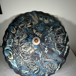 May include: A circular paper parasol featuring a dark blue and black graphic print of a rock band composed of monsters, including a vampire, a mummy, and a skeleton. The design includes the text "by Sol Rac" and "Undead Rod".