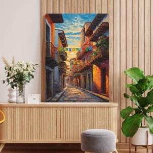 Jalisco Street Wall Art, Colorful Mexico Canvas Print, Papel Picado Decor, Mexican Street Scene, Latin Travel Art, Boho Framed Canvas Gift
Mexican Street Canvas Wall Art, Jalisco Architecture Painting Print, Colorful Framed Canvas, Mexico Wall Decor, Gift for Her, Art Print.Bring golden Mexican streets into your space with this vibrant Jalisco wall art print, glowing with colonial charm