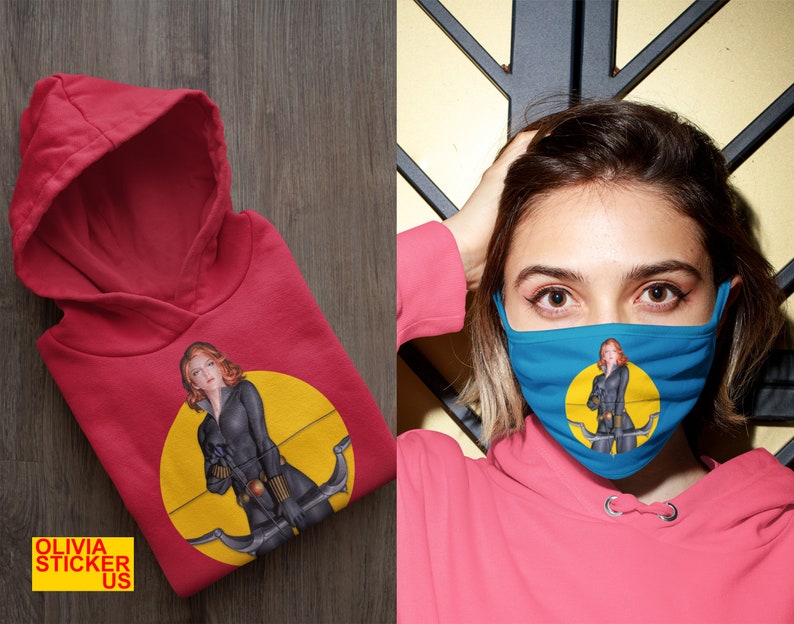 May include: Red hooded sweatshirt with a graphic of a woman in a black outfit holding a bow and arrow. The graphic is on a yellow circle with a black outline.