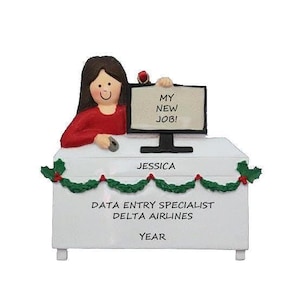 May include: A figurine of a data entry specialist at a desk with a computer that says "MY NEW JOB!". The desk is decorated with a green garland and the text "JESSICA", "DATA ENTRY SPECIALIST DELTA AIRLINES", and "YEAR".