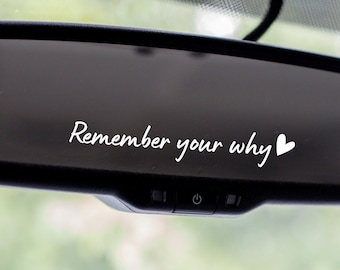 May include: A black rearview mirror with the text "Remember your why" and a small white heart.