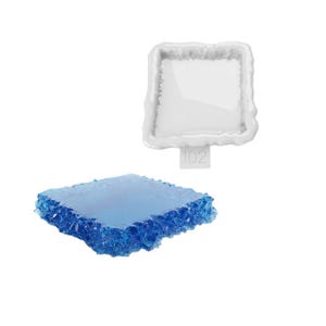 May include: A square silicone mould with a white finish and the text ID2 embossed on a small tab, paired with a square blue translucent resin piece featuring a textured, crystalline edge that matches the shape of the mould.