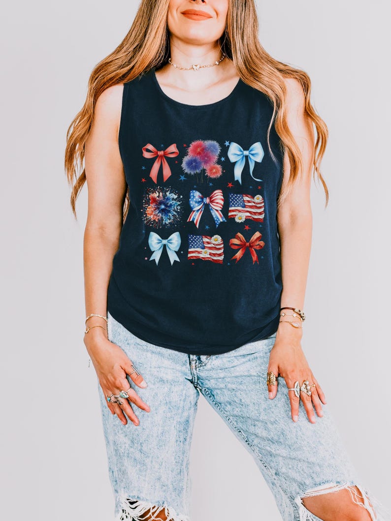 May include: A navy blue sleeveless tank top with a red, white, and blue bow and firework design.