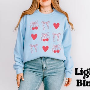 Zacht kersensweater | Oversized esthetische top | Krabbelafbeelding en strikontwerp | Mode-outfit voor vrijetijdskleding | Gezellige winterkleding afbeelding 3
