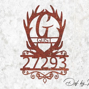 May include: A rusty brown metal sign featuring a deer antler design with the letter "G" in the center, the name "GUST", and the numbers "27293". The sign has a decorative scroll design at the bottom and is set against a textured, off-white background.