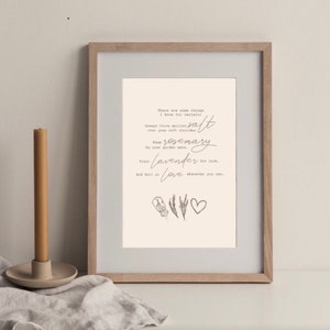 May include: A framed print with a light beige background and text that reads "There are some things I know for certain." The print includes the words "salt," "rosemary," "lavender," and "love." A candle and linen cloth are in the foreground.