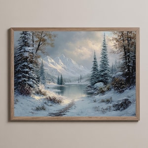 May include: A framed painting of a winter scene. The artwork shows a snow-covered forest and mountains reflected in a lake. The colour palette is dominated by whites, blues, and greys, creating a serene and cold atmosphere.