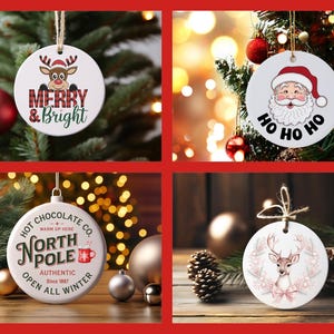 May include: Four round white ceramic Christmas ornaments with different designs. The first ornament features a red reindeer with the text "Merry & Bright". The second ornament features a cartoon Santa Claus with the text "Ho Ho Ho". The third ornament features a red and white mug with the text "Hot Chocolate Co. North Pole Authentic Since 1967 Open All Winter". The fourth ornament features a white deer with a pink bow and floral accents.