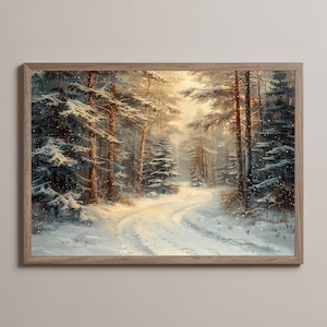 May include: A framed winter landscape painting. The artwork depicts a snow-covered forest with a winding road. Tall trees line the path, and the scene is illuminated by soft sunlight. The frame is made of light-colored wood.