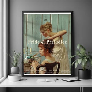 May include: A framed poster featuring the movie "Pride & Prejudice." The image shows two women in period clothing, one adjusting the other's hair. The poster has a black frame and is displayed on a white surface. The movie title is prominently displayed.
