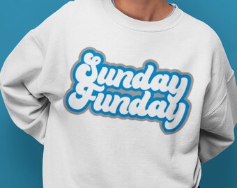 May include: White sweatshirt with a blue and gray graphic that says "Sunday Funday" in a retro font.
